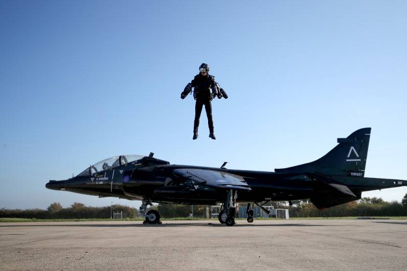 Watch a jet suit pilot fly onto a ship to trial the tech for fighting ...