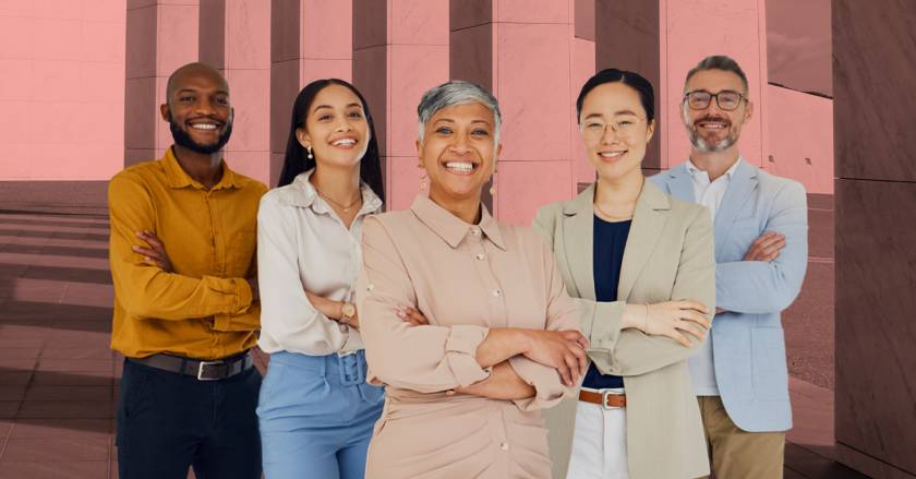 Group of five people smiling and arms crossed